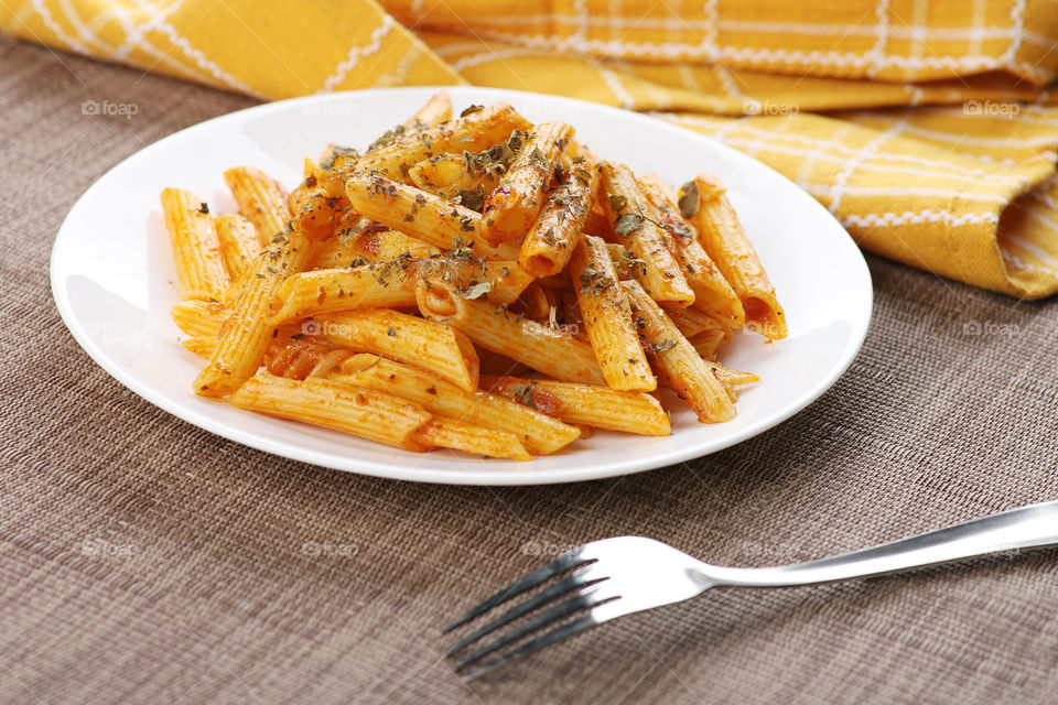 Penne Pasta served. Traditional Italian food.