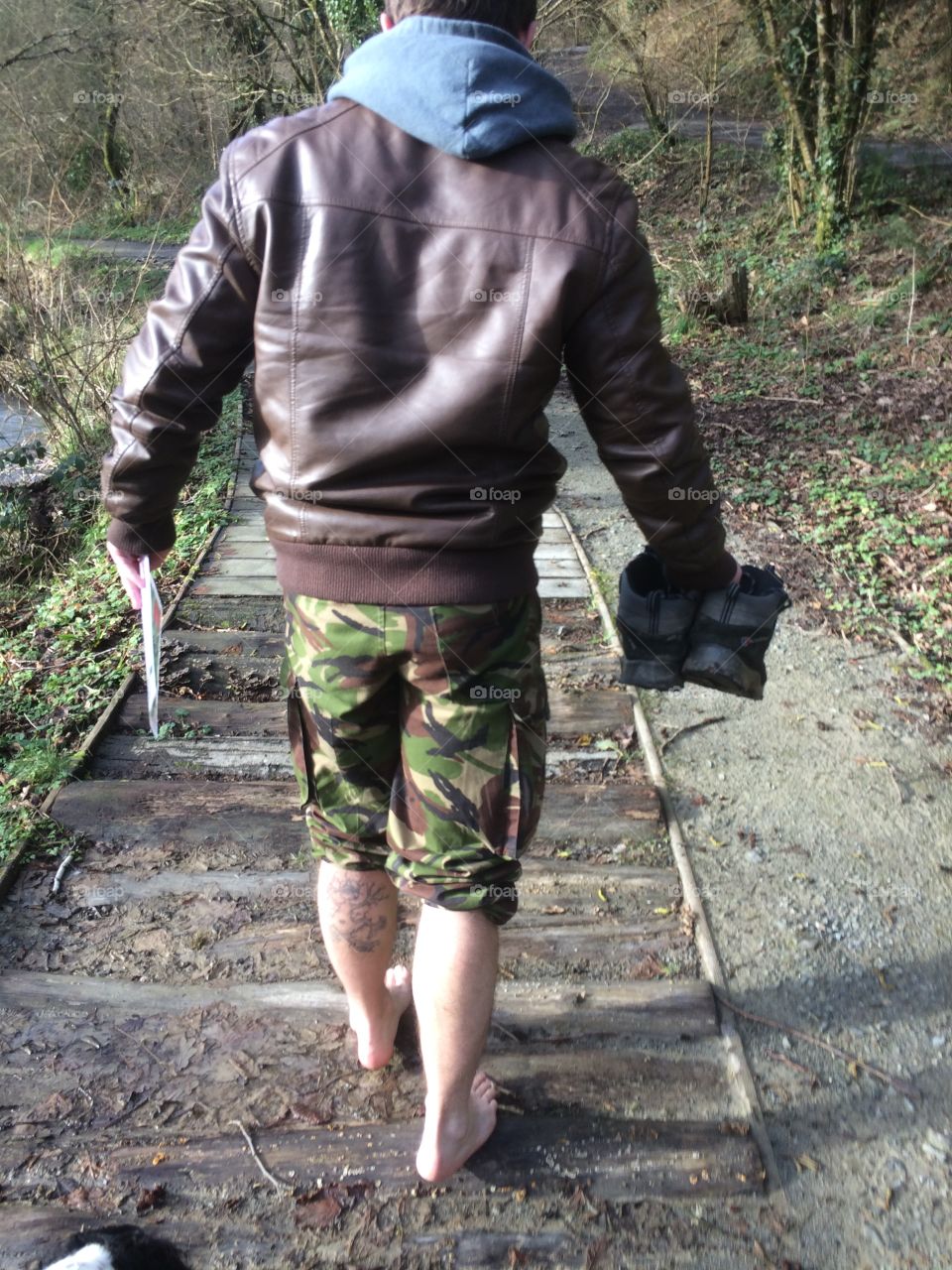 Man walking barefoot in nature