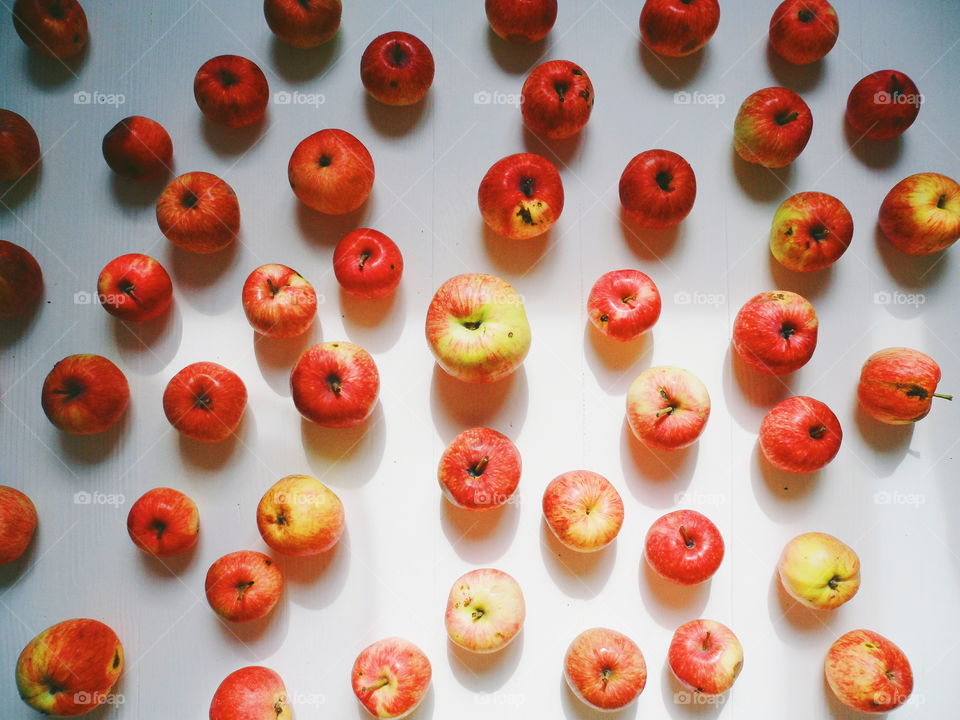 a lot of red apples on a white background