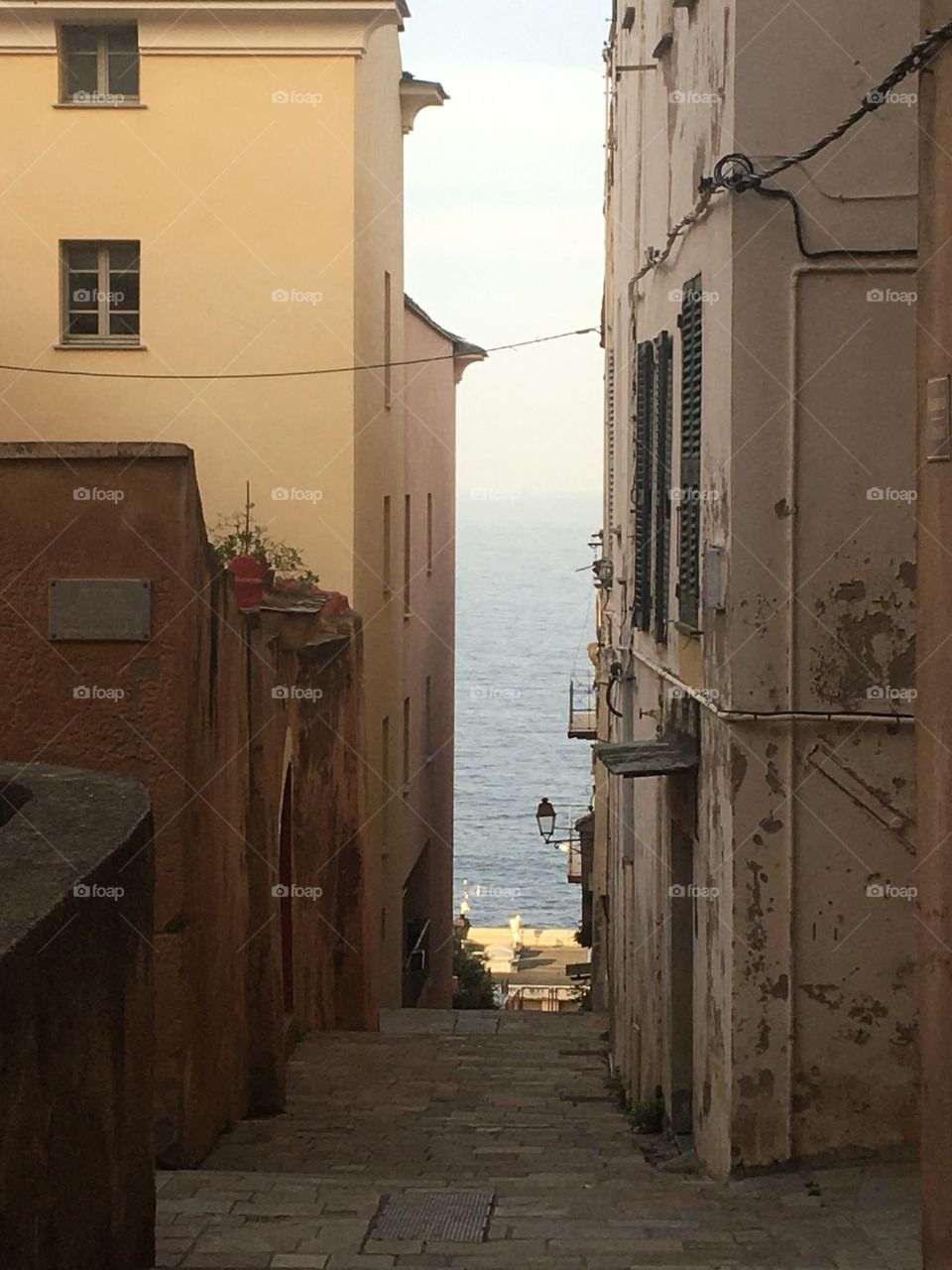 The view of the sea in the street of Corsica 