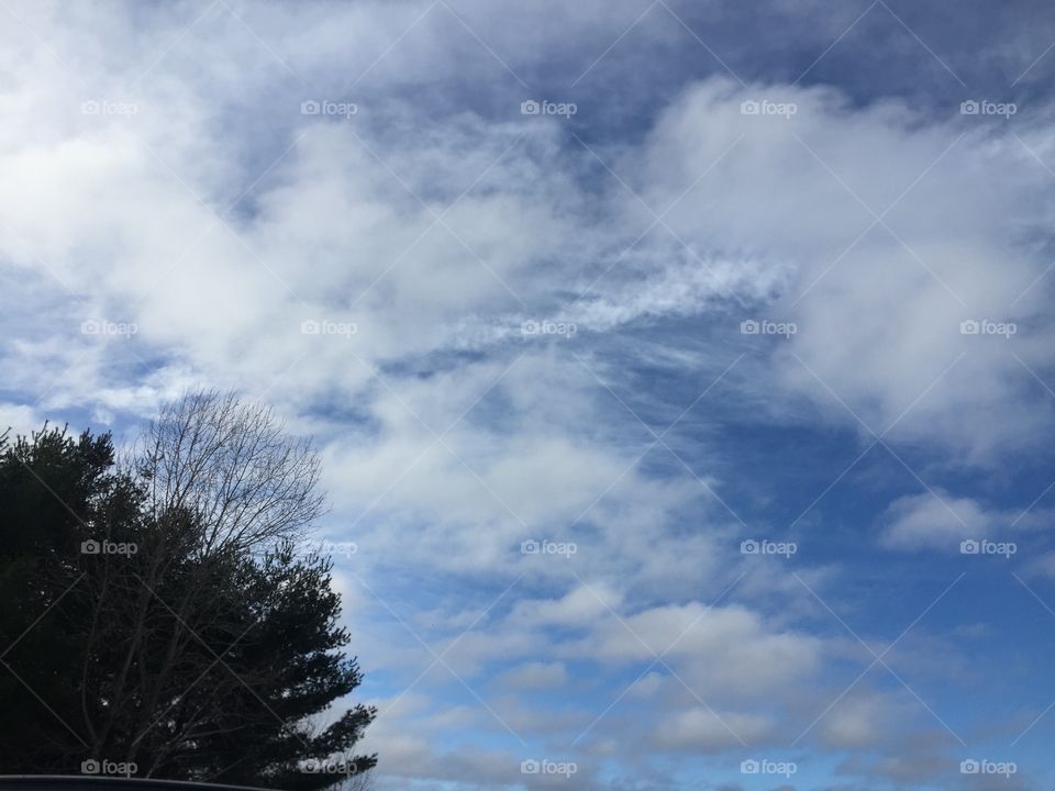 Beautiful clear day puffy clouds cool but bright blue peeking from behind the clouds