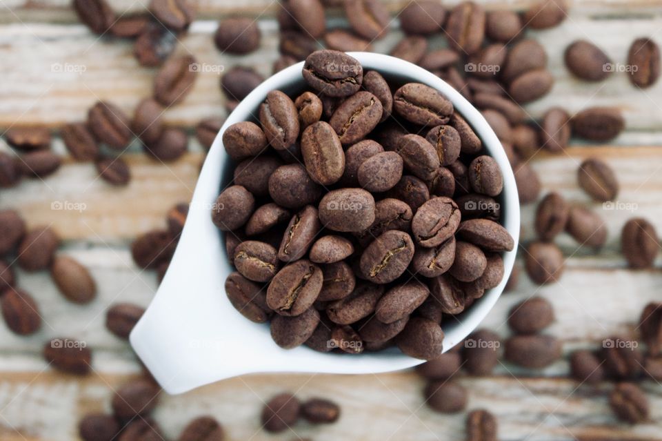 Coffee beans in a mug