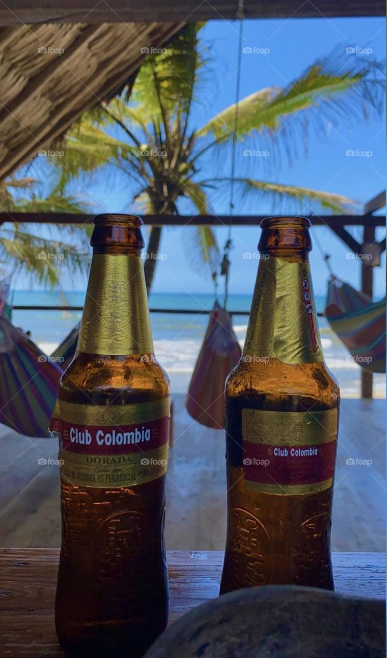 Relax and a beer enjoying the calm to the beach