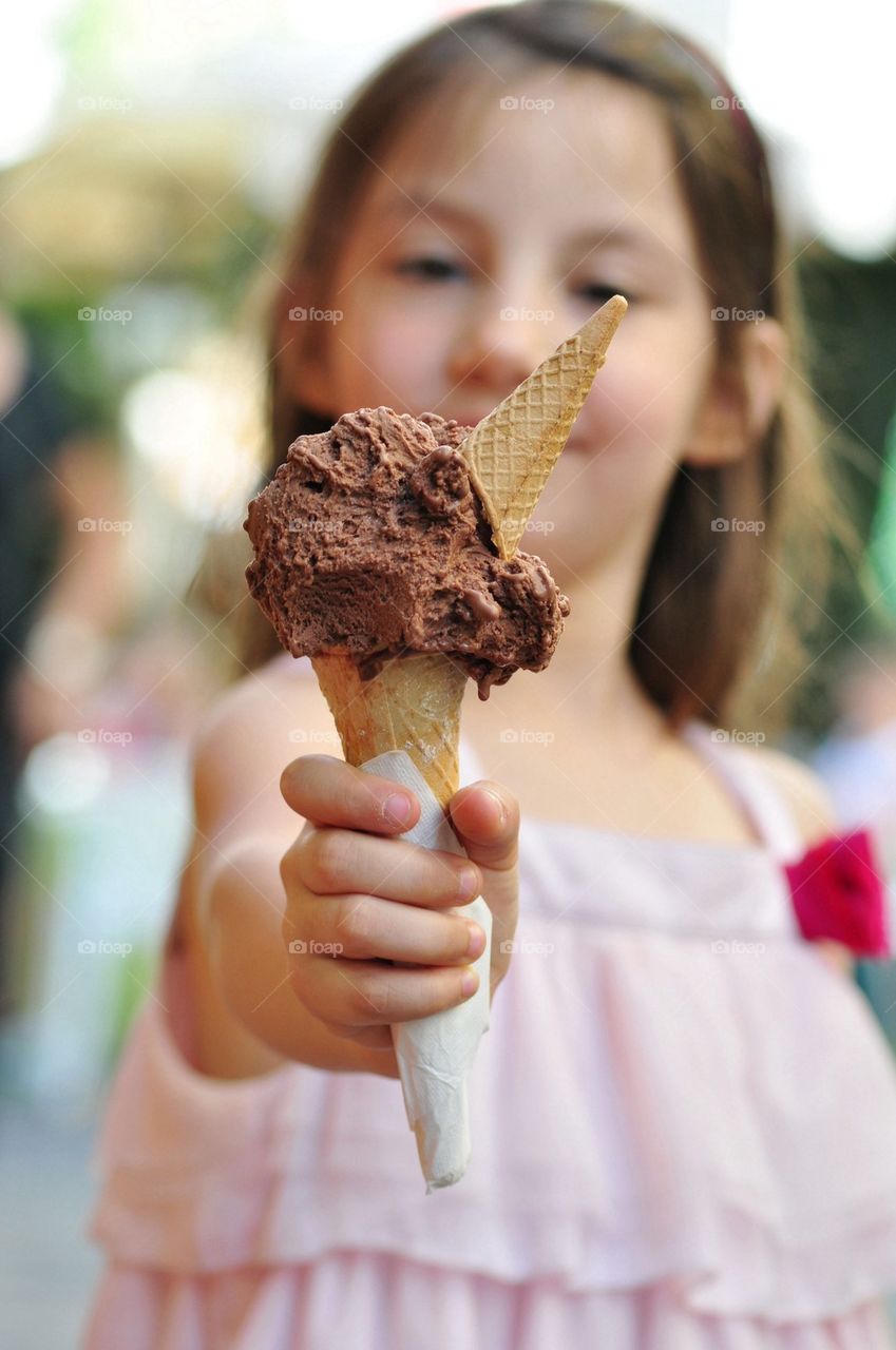 Little girl holding ice cream