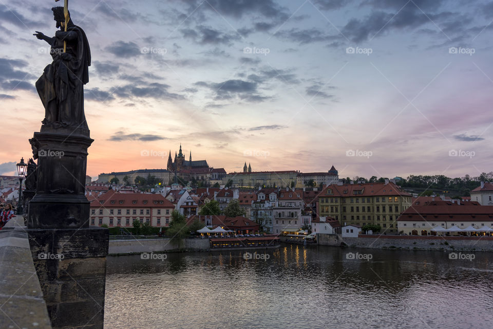 View of Prague from Charles bridge at sunset.