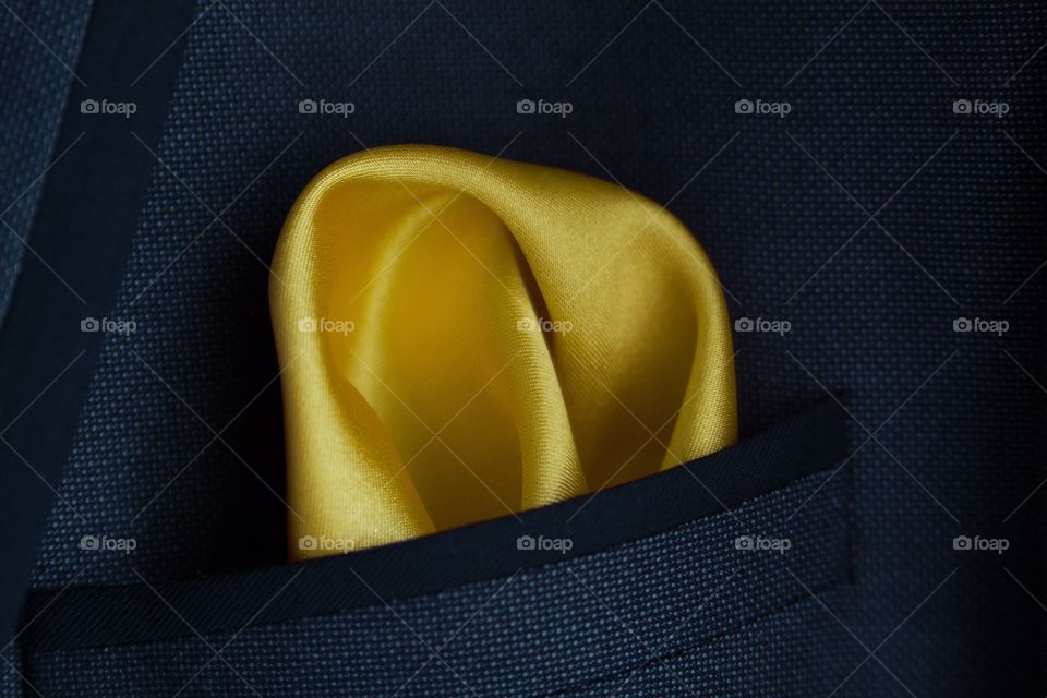 Yellow handkerchief in suit pocket 