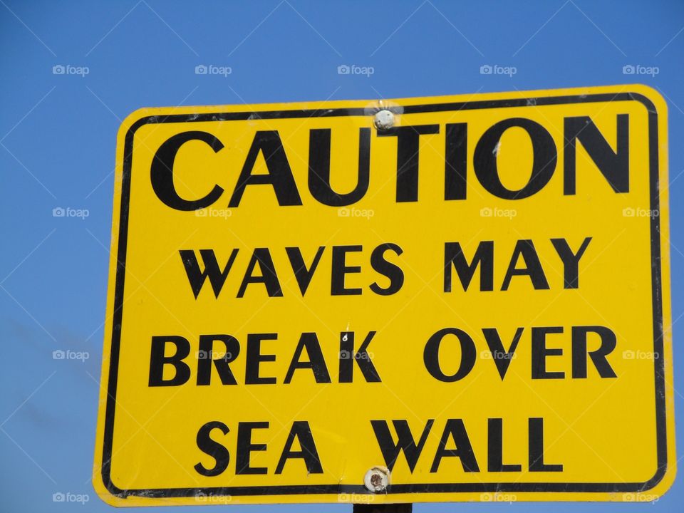 Caution break waves sign 