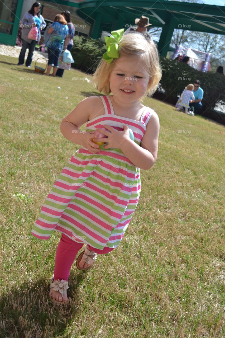Little Girl Running with Easter Eggsi