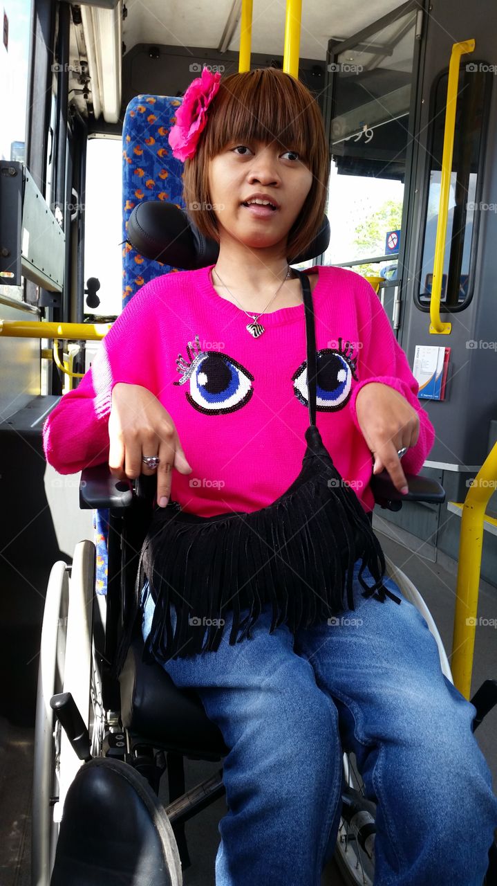 bus ride. girl in pink