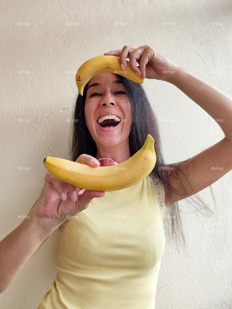 Portrait of Beautiful Smiling Woman with bananas