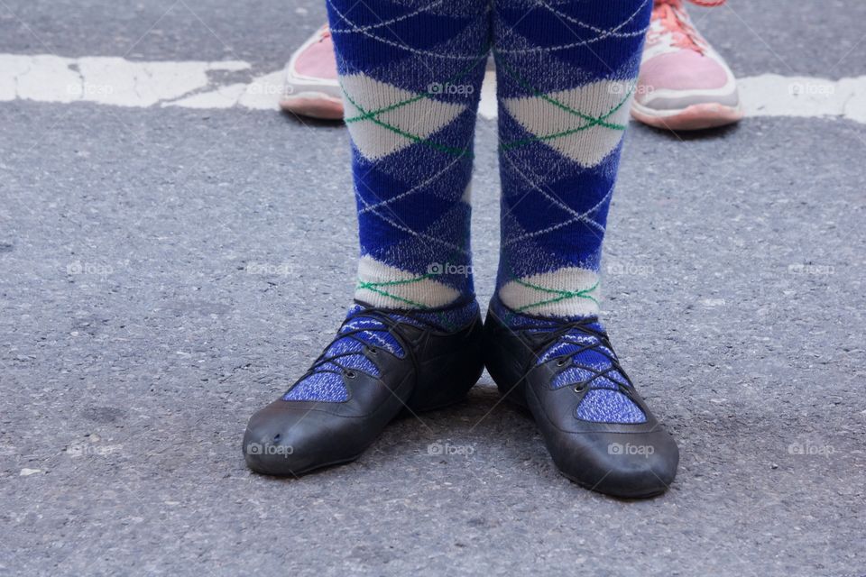 The legs of Scottish female dancers at the Annual Tartan Day Parade in Manhattan, New York City