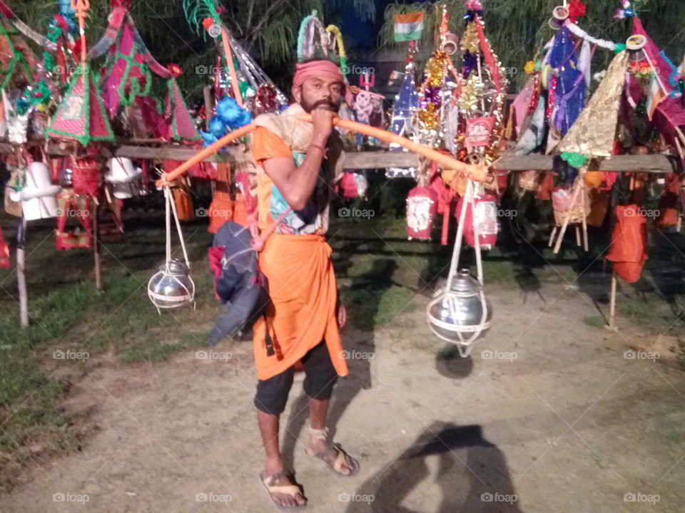 A devotee of Lord Shiva in beautiful dress with ' KANWAR' at Patiala city.