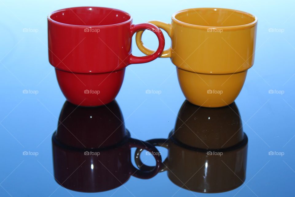 Yellow and red mugs