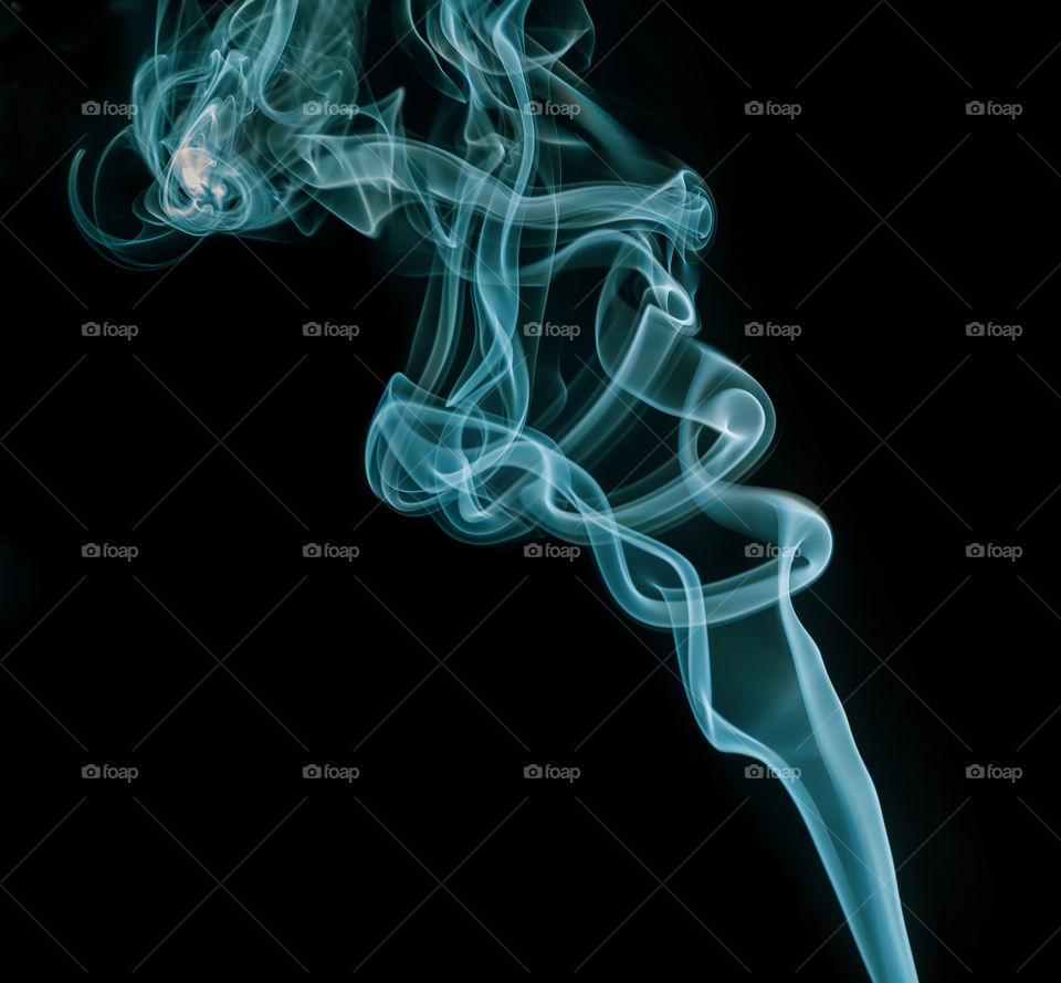 Blue smoke on black background, creative concept