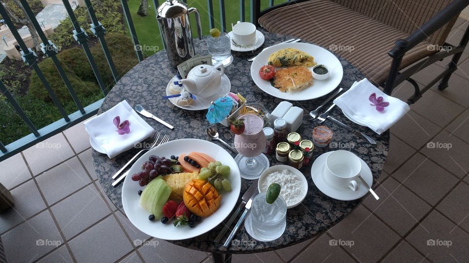 Deluxe breakfast on a balcony patio