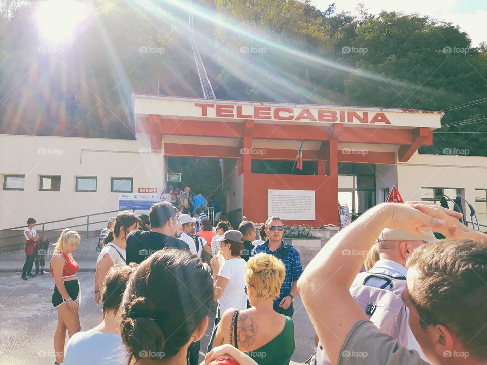 lots of tourists waiting to go up with the cable car