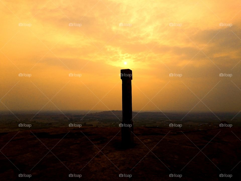 Sunset view - top of mountain - pillar as light house