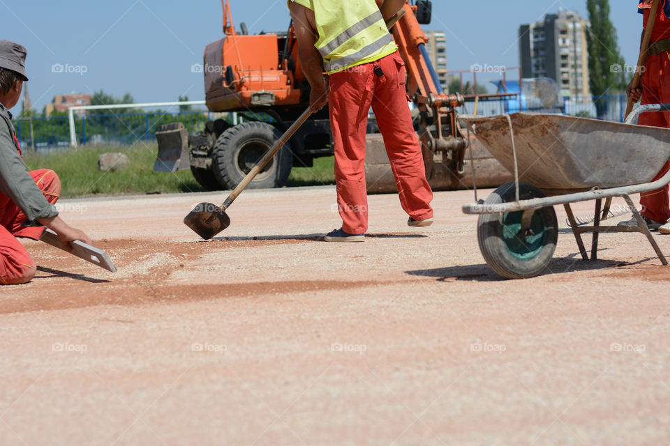 Construction worker. Construction worker with shovel on construction site