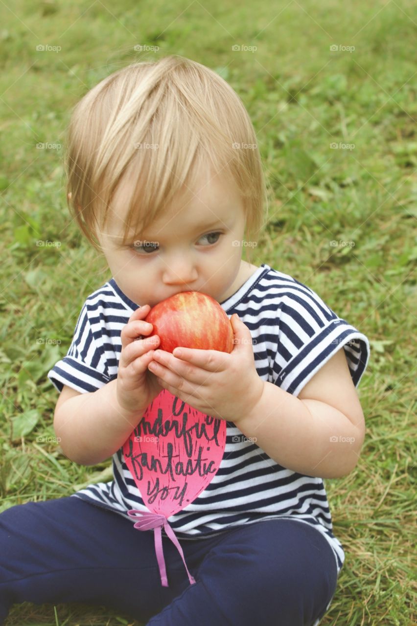 Child eating apple