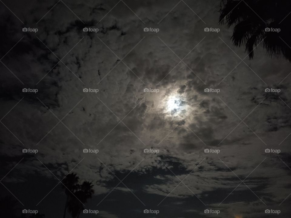 moon hiding in the clouds