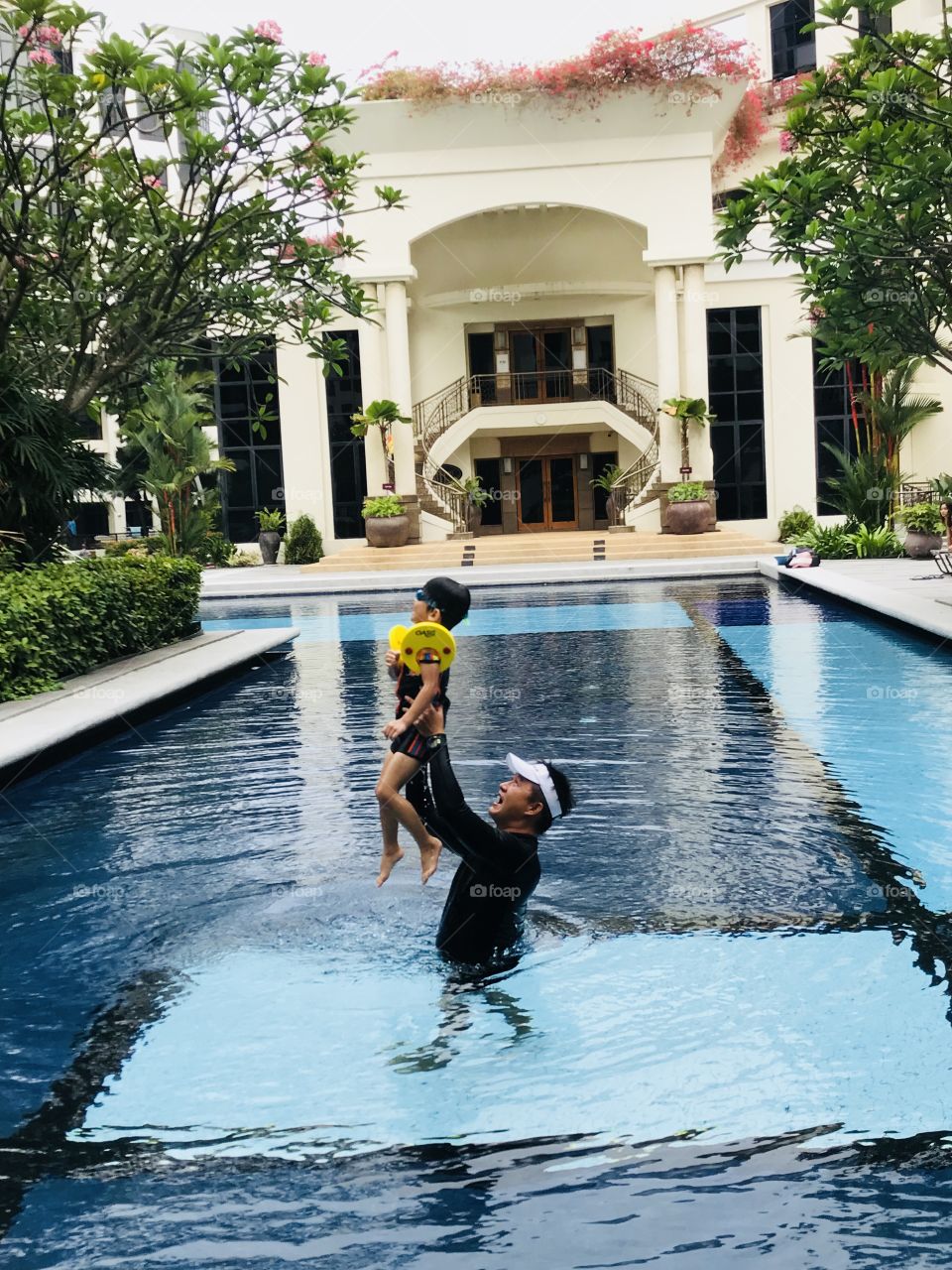 Dad and Son Swimming with fun