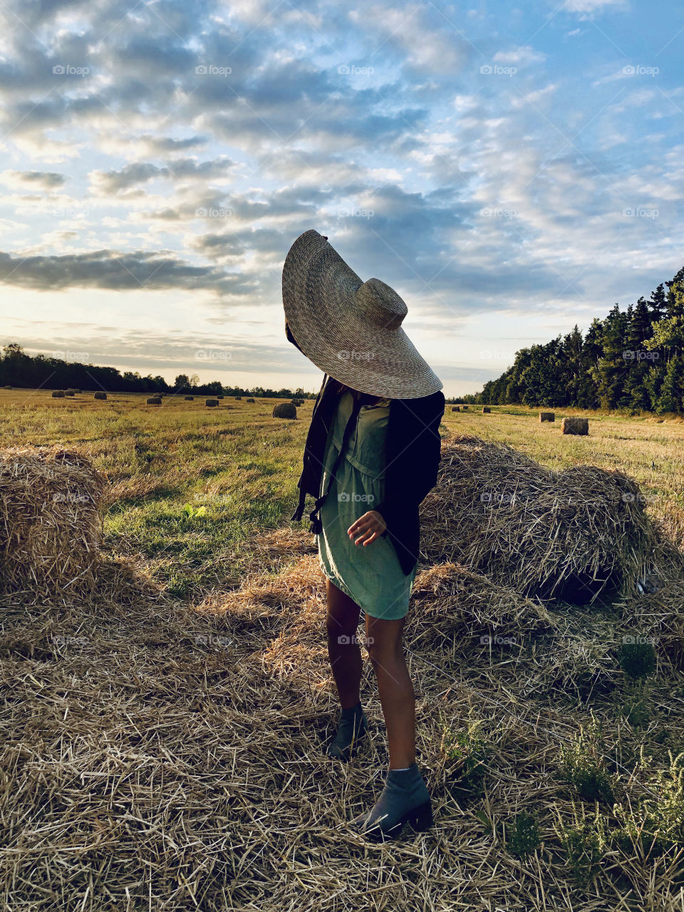 Beautiful girl in big hat 