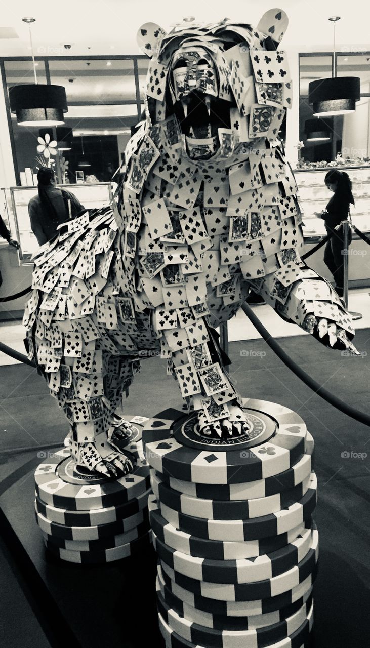 Lion made from metal decks of cards in black and white