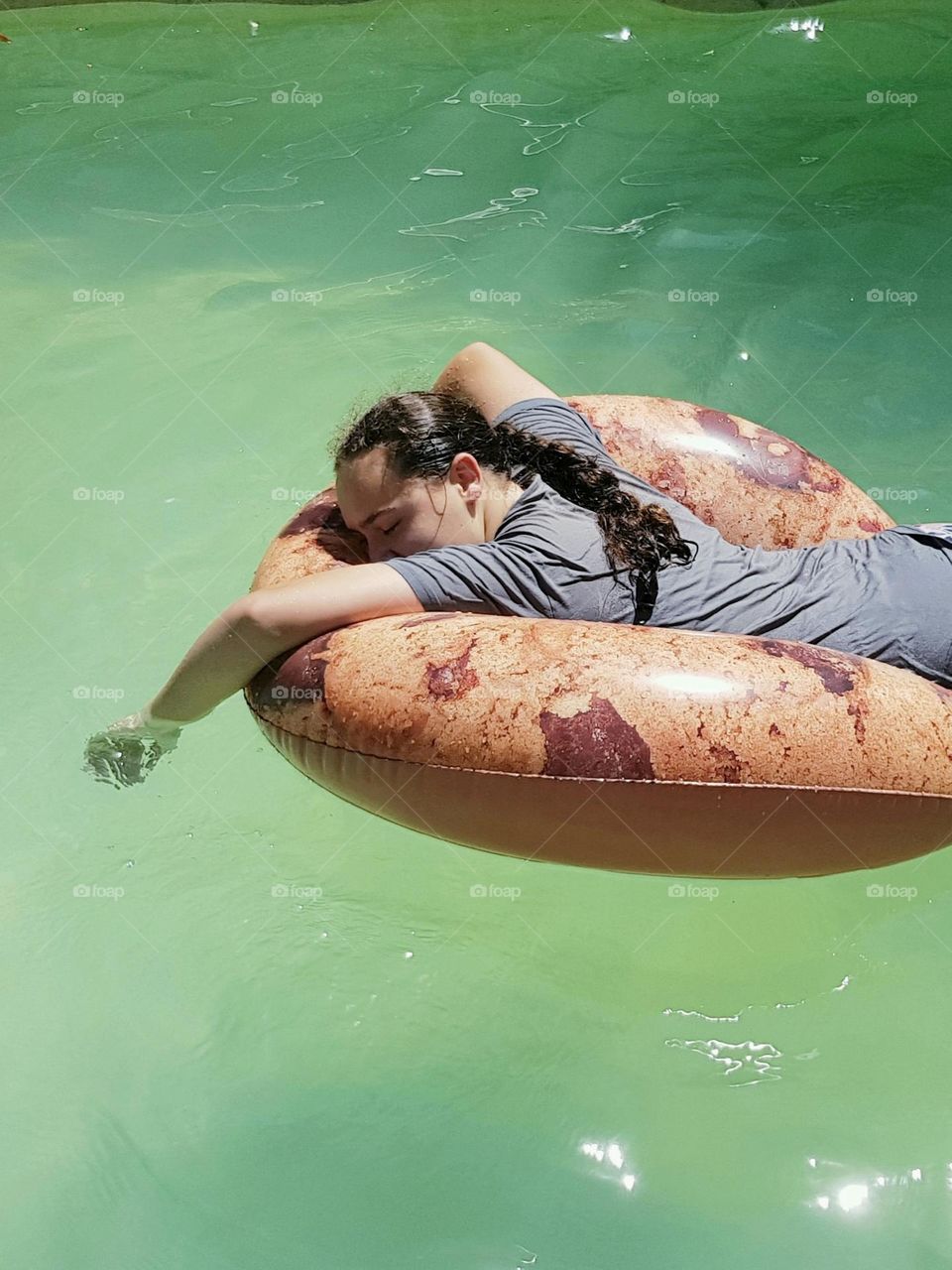 Peacefully floating in the pool