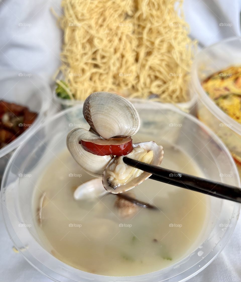 Asian food includes lala clam soup, curry fish head, bitter gourd pork and crispy twin tower noodles 