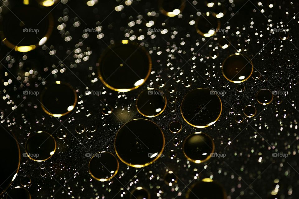 Oil golden bubbles close up background amazing droplets with colours trippy psychedelic minimalist art attack making wonderful view