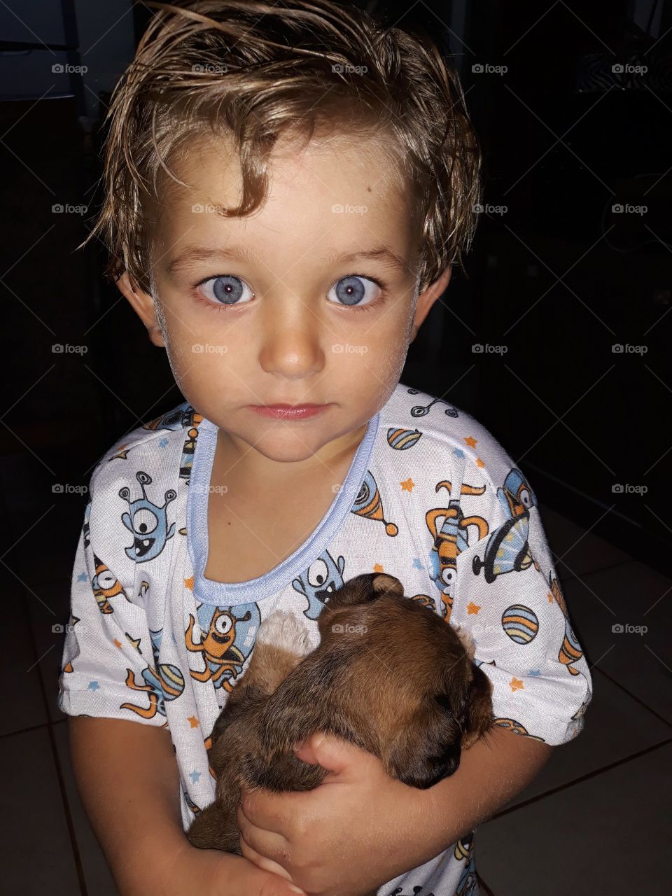 cute child playing with the dog