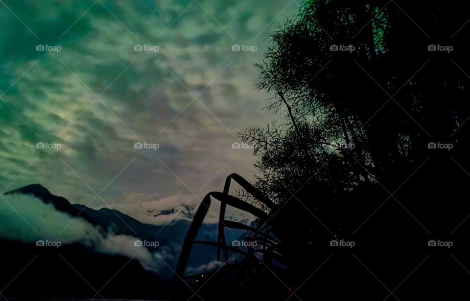 A cloudy night on mountain peaks