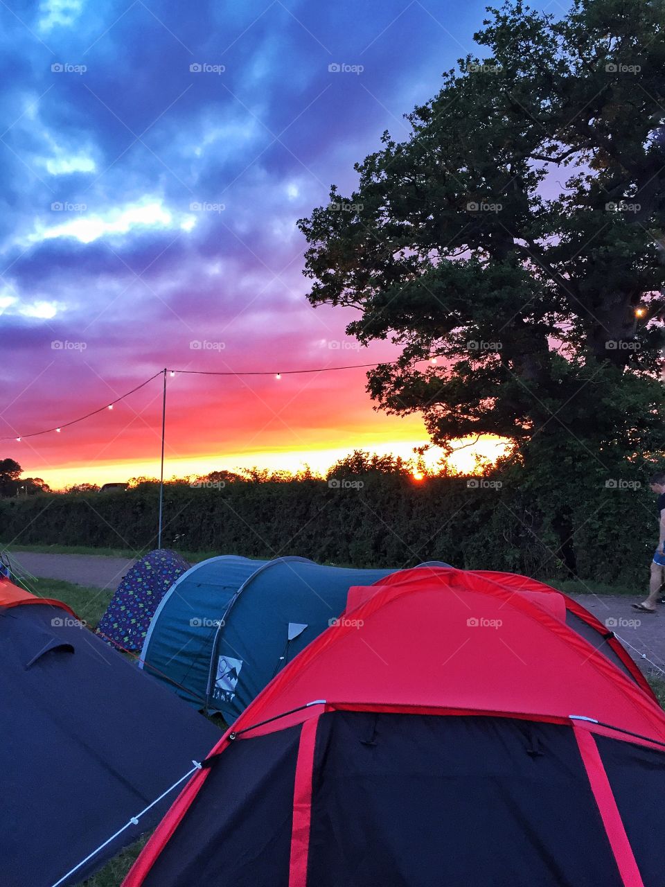 Camping under dramatic evening sky