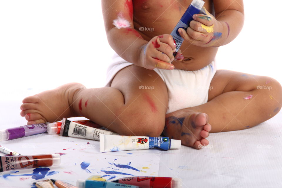 a kid with paints