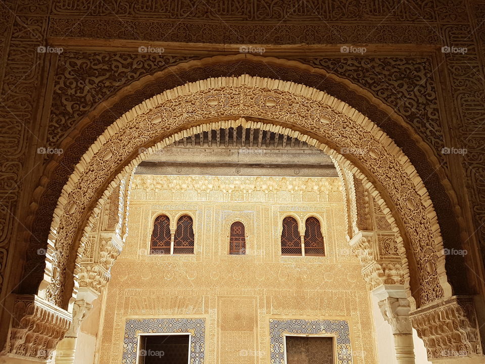 Beautiful arch in the califal style in one of the Alhambra palaces. Granada. Spain.