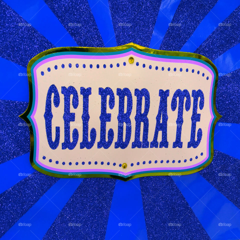 Close-up of celebrate sign board