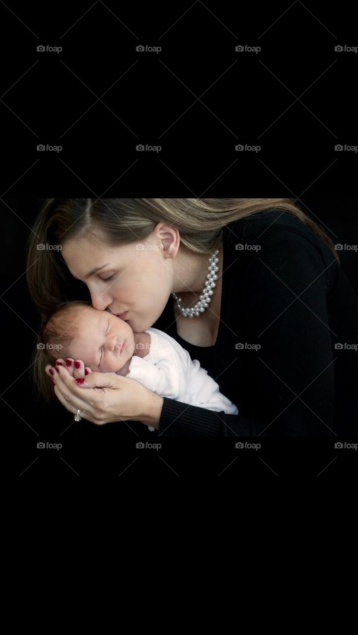 Mom Kissing newborn