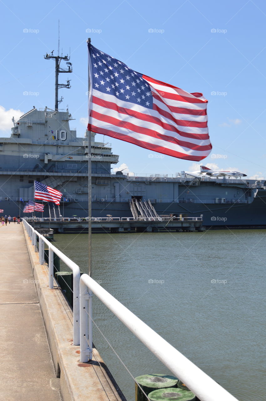 Row of American flags on a pier