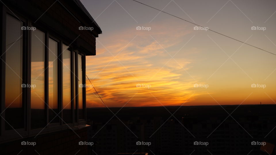 Silhouette of building exterior during sunset