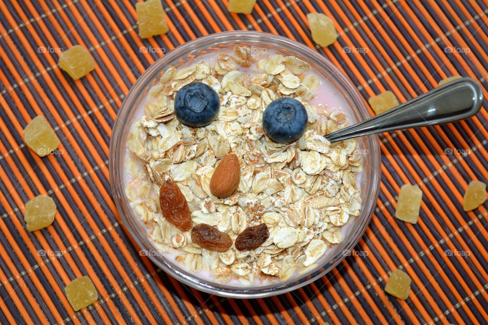 tasty healthy food oat with nuts and berries table background