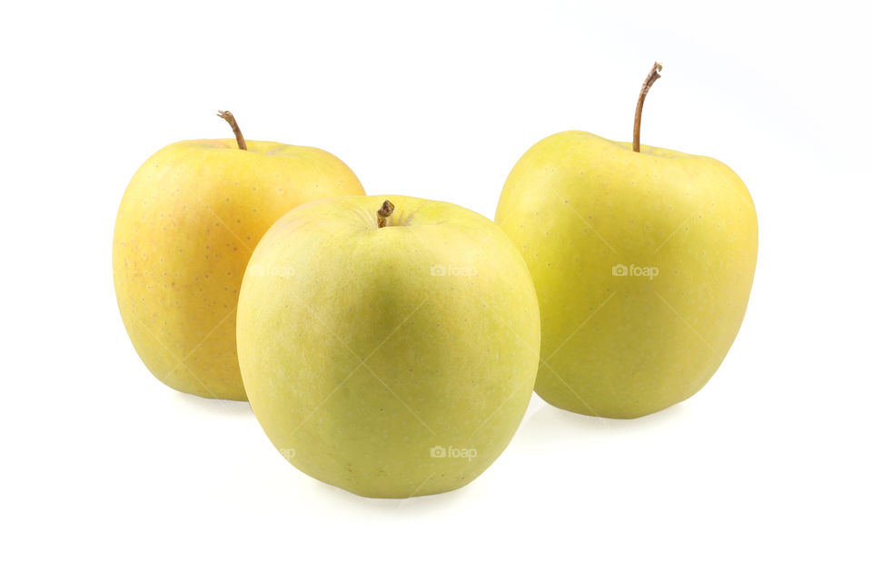 Yellow apples. Three yellow apples on white background