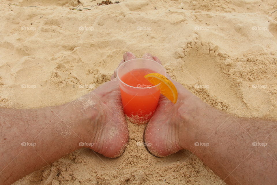 Tequila sunrise between the feet