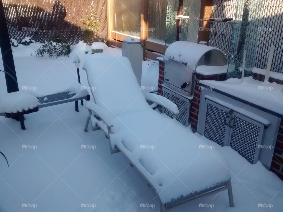 Patio Furniture covered with Snow