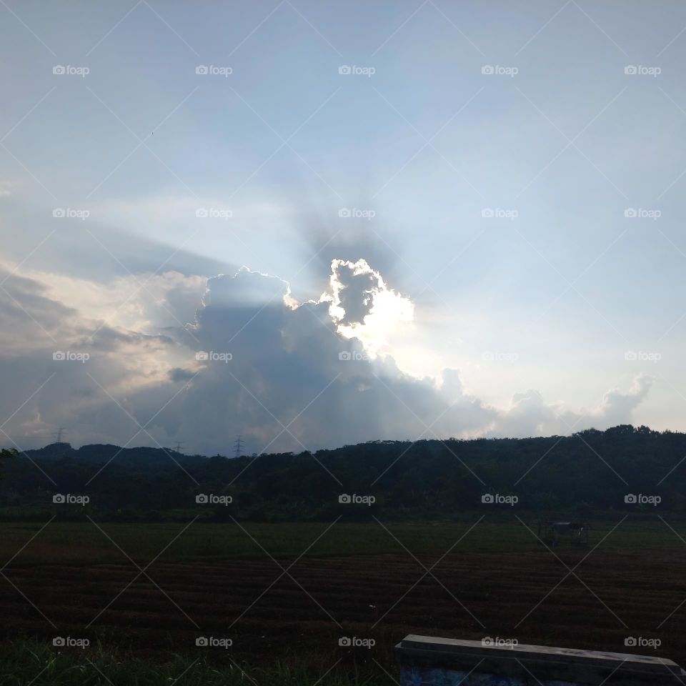 Afternoon in the fields when the sun is covered by clouds