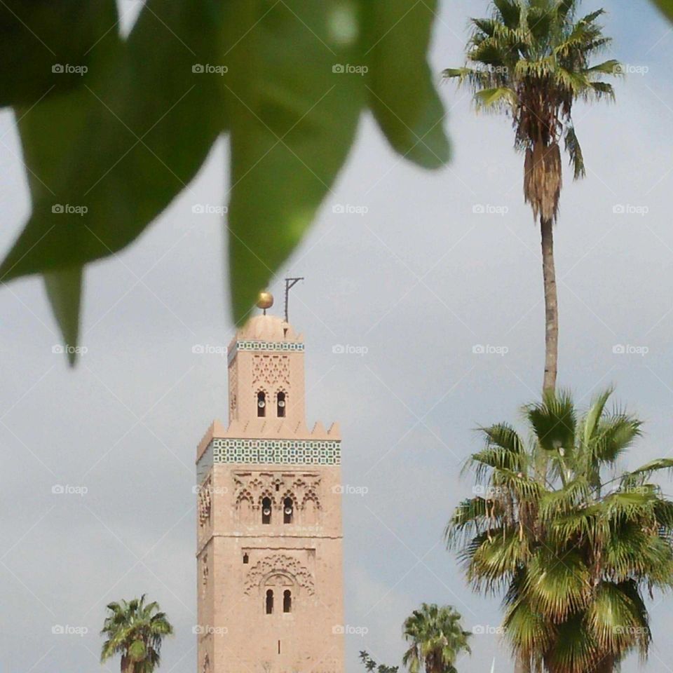 Tower of mosque ancient building in Marrakesh city in Morocco.