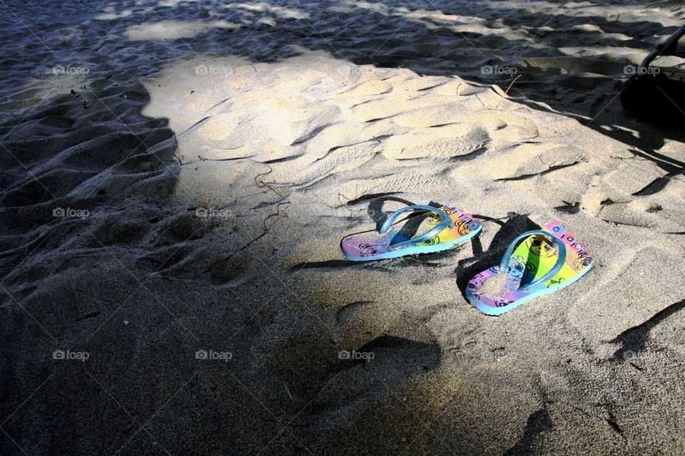 Flip flops on a sea shore