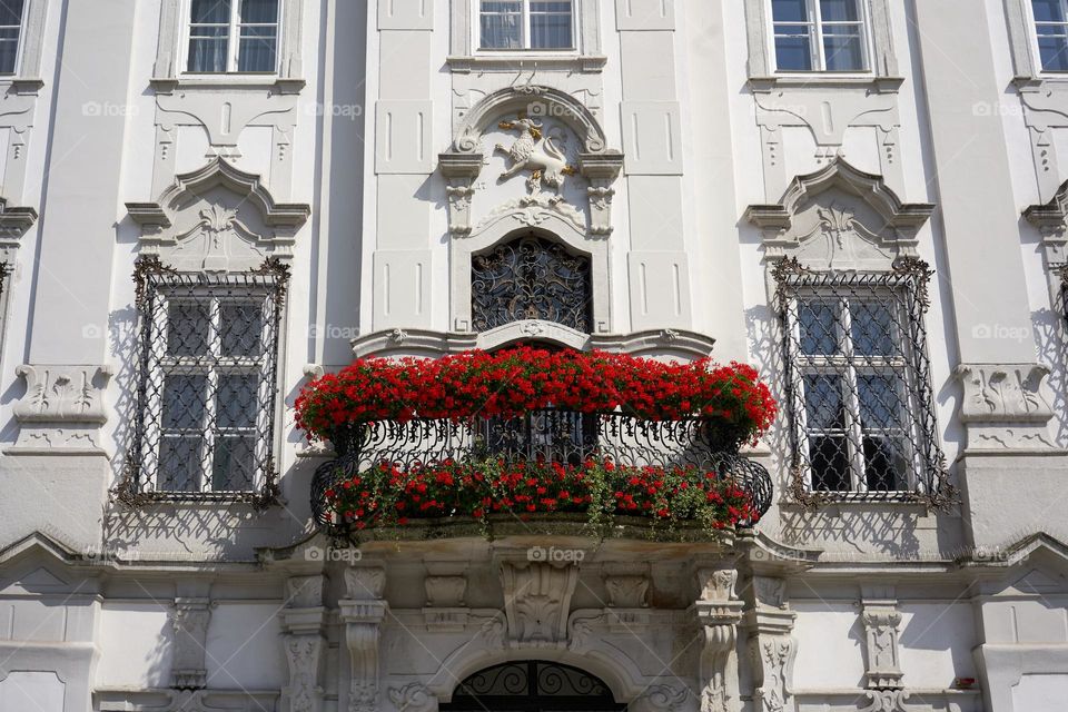 A wonderful vintage balcony framed with flowers 