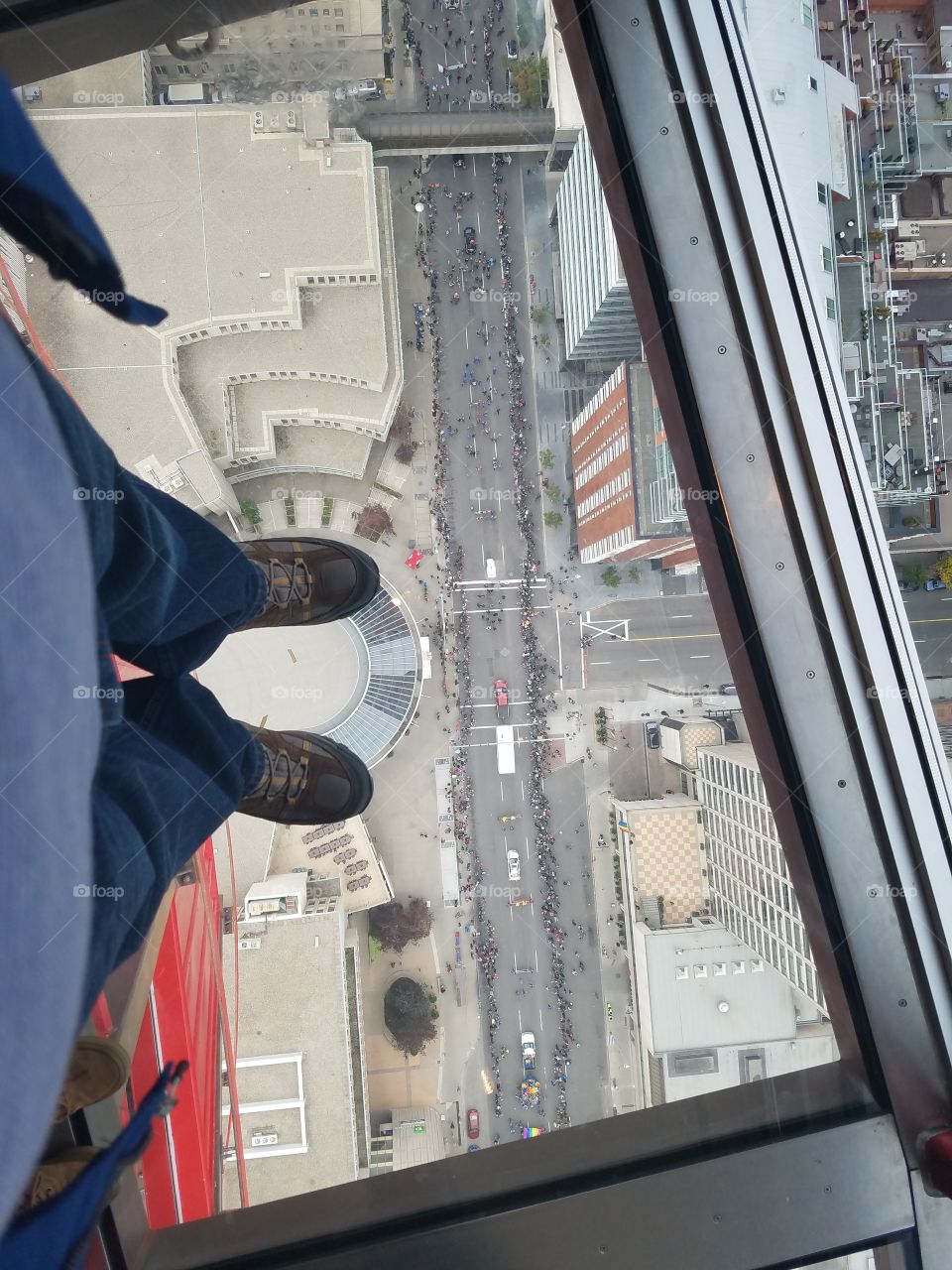 Above Calgary, pride parade marching below.