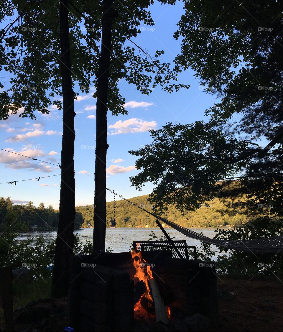 Sunset on a lake by the campfire