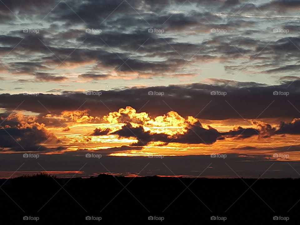 Orange Clouds At Sunset